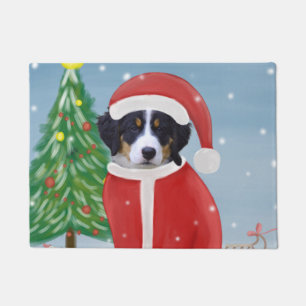 Felpudo Perro de montaña de Bernese en nieve con regalos d