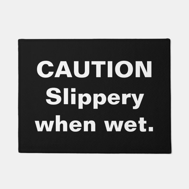 Felpudo Precaución. Resbaladiza cuando está mojada. Doorma (Anverso)