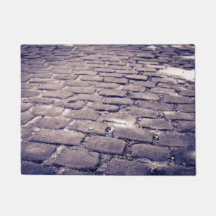 Felpudo Primer plano de calle empedrada