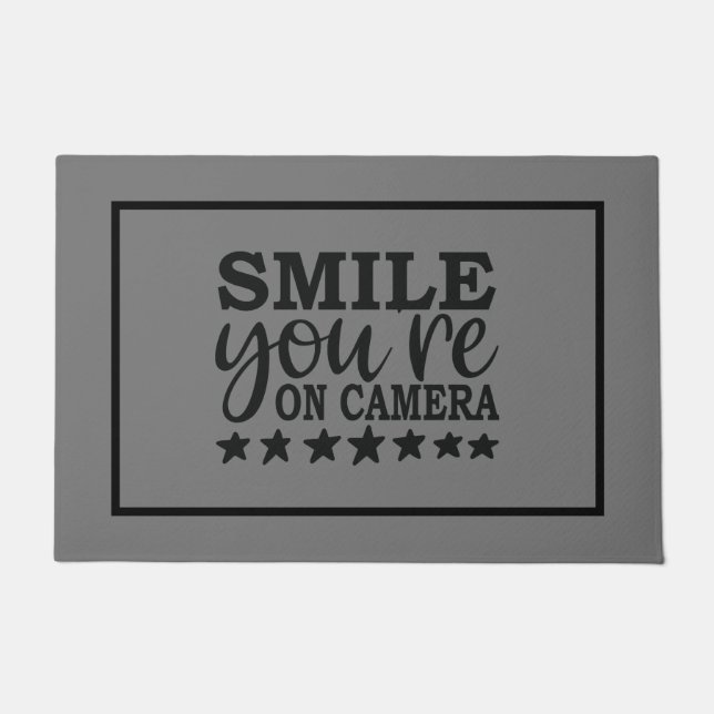 Felpudo Sonríe, estás en cámara (Anverso)