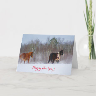 Festiva Caballos en la tarjeta del Año Nuevo de la nieve