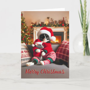 Festiva Gato de Tuxedo sosteniendo una tarjeta de Navidade