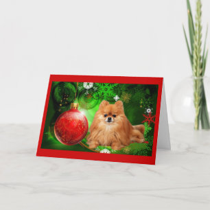 Festiva Navidades pomeranos con la tarjeta roja de bola ve