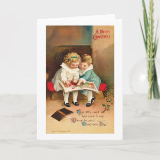 Festiva Niños leyendo la tarjeta de Navidades de libros