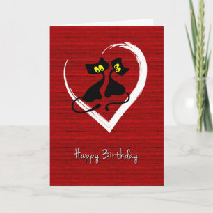 Festiva San Valentín con gatos negros en tarjeta cardíaca