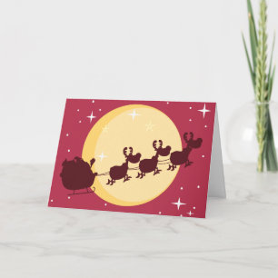 Festiva Santa que conduce una tarjeta de felicitación del