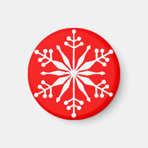 Festiva Snowflake en un imán decorativo rojo.