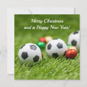 Festiva Tarjeta de Navidades de fútbol con bola sobre césp