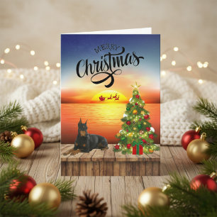 Festiva Tarjeta de Sunset para Navidades Doberman