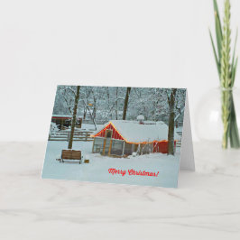 Festiva Tarjeta navideña con una escena de granja nevada