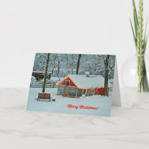 Festiva Tarjeta navideña con una escena de granja nevada