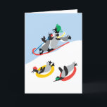 Festiva Tarjeta personalizada de pingüinos en trineo<br><div class="desc">¡Simple diversión! Una imagen nevada de pingüinos en trineo. ¡Es adorable! El diseño original del artista dag dart es muy caprichoso y alegre. La tarjeta se puede personalizar. Puedes cambiar el saludo interior como quieras.</div>