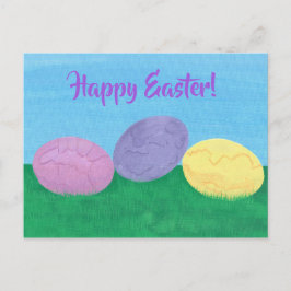 Festiva Tres coloridos huevos de Pascua en una postal verd