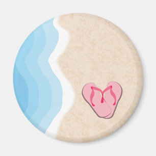 Flip-Flops rosa en el imán de la playa