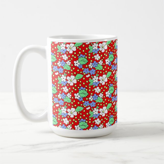 Flores blancas y azules en taza de café roja (Izquierda)