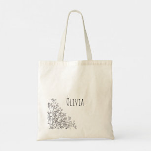 Flores cortas y elegantes en la bolsa de la tote