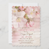 Flores de cerezo en la invitación a la madera
