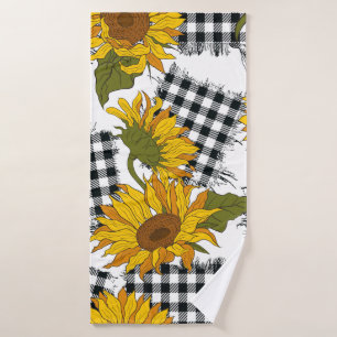 Flores de girasol brillantes en parches a cuadros.