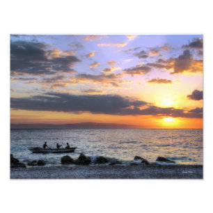 Foto Bote de remos y puesta del sol en el océano