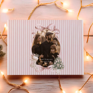 Foto de Navidad con cinta de color rosa en el árbo