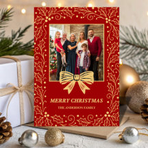 Foto de Navidad familiar con lazo rojo y dorado an