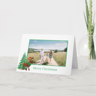 Foto de reno y árbol de Navidad