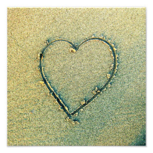 Foto del corazón del dibujo de la arena