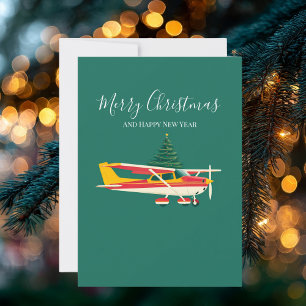 Foto divertida de avión antiguo y árbol de Navidad