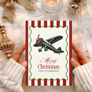 Foto divertida de avión antiguo y árbol de Navidad