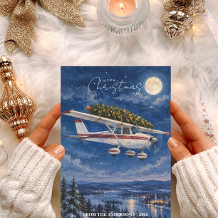 Foto divertida de avión vintage y árbol de Navidad