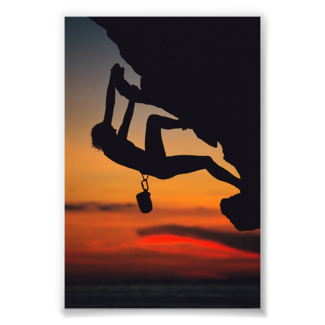 Foto Escalador de rock colgante al amanecer (Frente)