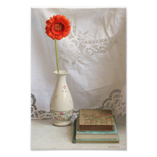 Foto Naranja gerbera y libros