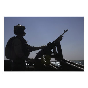 Foto Técnico que sirve una ametralladora M240 en Iraq
