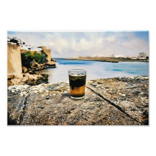 Foto Vidrio del té con fondo de la costa escénica