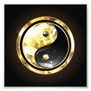 Foto Yin Yang dorado sobre negro