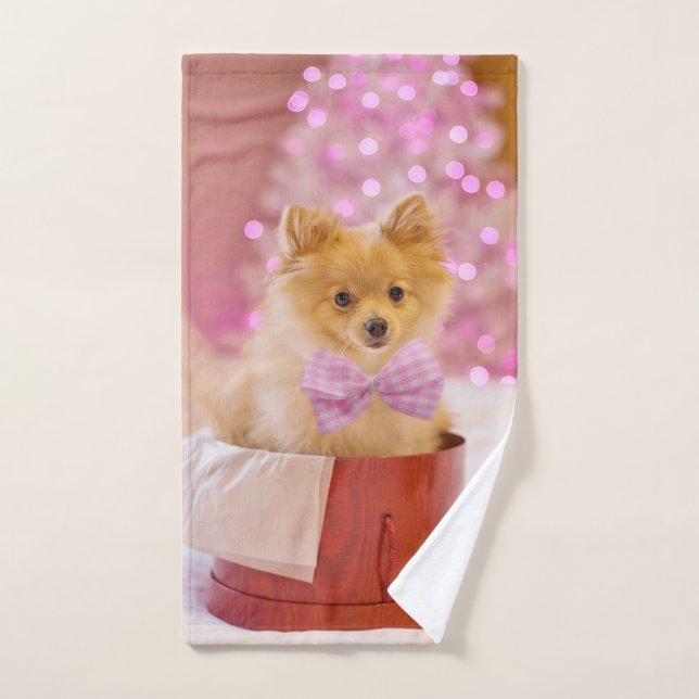 Fotografía de Navidad de perro lindo con lazo rosa (Toalla de mano)