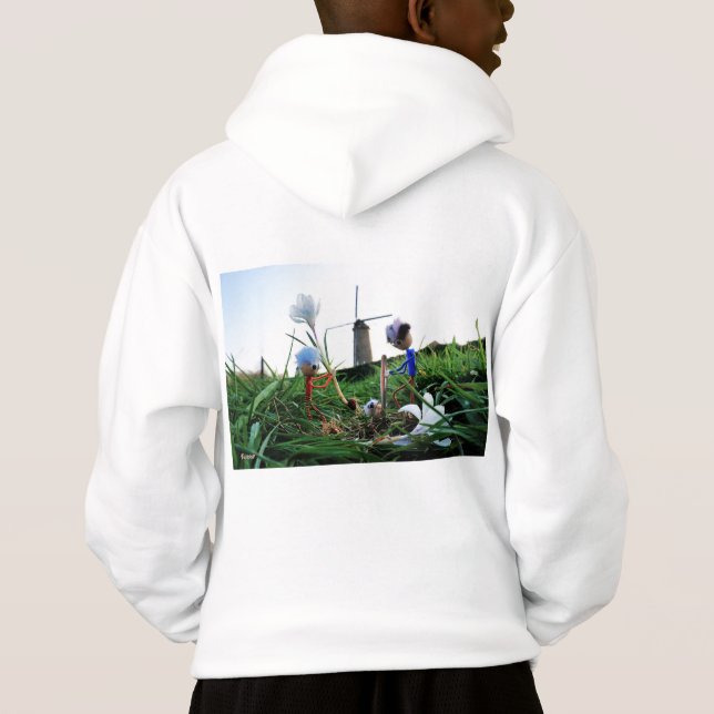 Fubby's bij een molen planten een krokus bol. (Reverso)