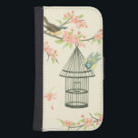 Funda Cartera Para Galaxy S4 Pájaros pequeños encaramados en una rama y en una<br><div class="desc">Nancy Slocum ha pintado muchas aves a lo largo de los años. Esta imagen retrata dos pequeños pájaros azules y amarillos encaramados en una rama rodeada de flores rosadas que parecen curiosos por una jaula. Obtén hoy esta interesante pieza de arte sobre la temática de las aves en tu producto...</div>