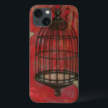 Funda Para iPhone 13 Abertura decorativa con mariposas<br><div class="desc">Dos mariposas pálidas se abalanzan alrededor de una jaula de pájaros en esta pintura de Norman Wyatt. Las hojas cuelgan sobre la jaula de pájaros,  y todo descansa sobre un fondo de cardenales. ¡Pida esta impresión hoy!</div>