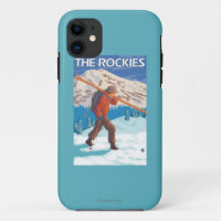 Esquís de la nieve del esquiador que llevan - los