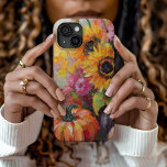 Funda Para iPhone 15 Floral y calabazas de otoño coloridas<br><div class="desc">Una pintura abstracta vibrante y moderna que muestra un juego de calabazas, girasoles y otros follajes otoñales. Los ricos tonos otoñales como el naranja quemado, los rojos profundos, los rosa y los amarillos dorados se mezclan con las brochas suaves y los toques de color audaces. El estilo abstracto añade un...</div>