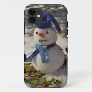 title_seo2 Hombre de nieve con Gorra azul y bufanda