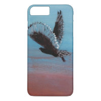Lechuza Tawny volando al amanecer