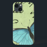 Funda Para iPhone 13 Mariposa de ala azul en postal Verde azulada<br><div class="desc">Esta postal verde azulada lleva un mensaje de belleza. Una delicada mariposa de ala azul descansa sobre la tarjeta,  oscureciendo parte del guión que contiene. Esta impresión de Vision Studio le haría una gran adición a su hogar!</div>