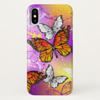 Mariposas monarcas en fondo morado