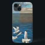 Funda Para iPhone 13 Tres gaviotas blancas volando sobre el agua<br><div class="desc">¿Necesitas escapar? Hazlo eligiendo este cuadro de la artista Tara Friel que representa a tres gaviotas que sobrevuelan el agua. La vista de las olas del océano y los vivos colores hacen que este diseño sea muy realista.</div>