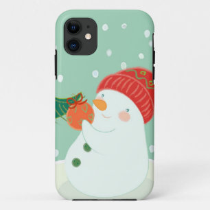 Funda Para iPhone 11 Un muñeco de nieve que cuelga un ornamento en un