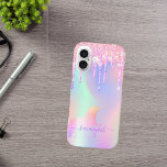 Funda iPhone 16 Nombre holográfico de goteo rosa de unicornio<br><div class="desc">Un fondo iridiscente a la moda con unicornio y colores pastel de arcoiris en tonos rosa, violeta y verde menta. Decorada con finas goteo purpurina en unicornio rosa, violeta y de color arcoiris. Letras de color púrpura. Personaliza y agrega tu nombre. El nombre está escrito con un guión moderno de...</div>