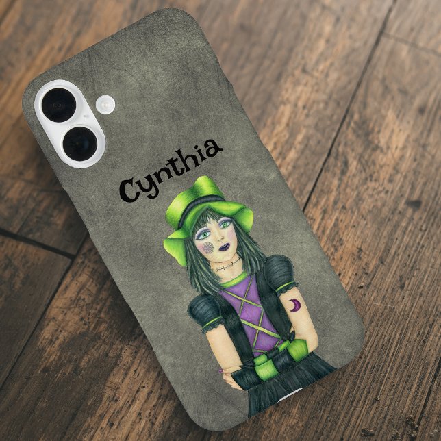 Funda iPhone 16 Plus Goth Girl Green Black Hair Tattoos Grey (Goth girl green hat  and hair with spiderweb and moon tattoos on yellow grey iPhone case.)