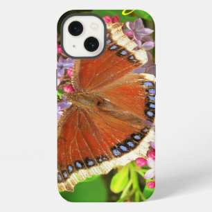 Brown Butterfly with Blue Spots on Lilacs